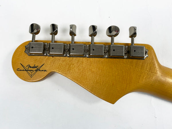 Vintage Fender Custom Shop guitar headstock with six vintage-style tuning pegs on natural wood finish background