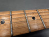 Close-up of natural wood guitar fretboard with metal frets and black dot inlays on Coffee House Guitars electric guitar