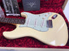 Fender Custom Shop vintage cream Stratocaster electric guitar with rosewood fingerboard and white pickguard in red plush-lined case with owner's manual and custom care booklet