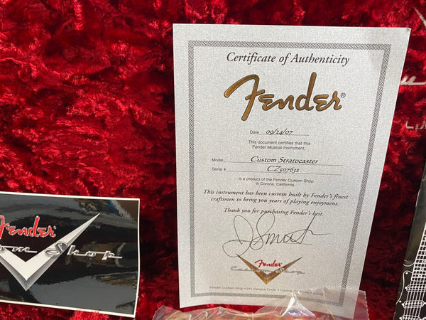 Fender Custom Shop Certificate of Authenticity for Custom Stratocaster dated 09/24/07 with serial number CZ507632 on red plush guitar case lining with Fender Custom Shop logo card.