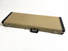 Vintage rectangular guitar hard case with beige textured exterior and black leather handle and corner protectors, metal latches, and white stitching.