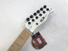 FGN electric guitar headstock with white finish, black tuning pegs, maple fretboard, and drop C tuning caution tag attached