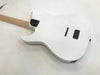 White electric guitar back with natural wood grain finish, maple neck, string ferrules, and battery compartment on white background
