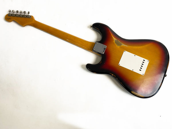 Vintage sunburst electric guitar back view with maple neck and metal tuning pegs showing wear and aging, classic rock style instrument at Coffee House Guitars