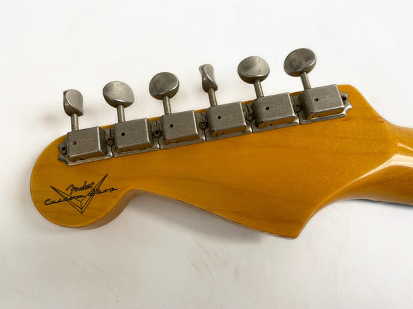 Vintage Fender Custom Shop electric guitar maple headstock with six vintage tuners against white background