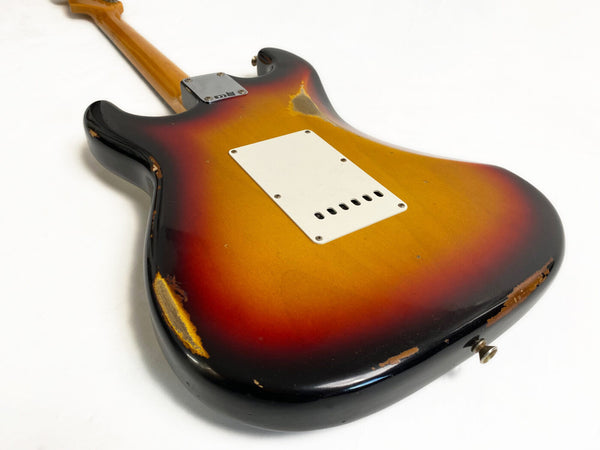 Vintage sunburst electric guitar body with visible wear and aging, showing back plastic cover plate and neck attachment plate on white background