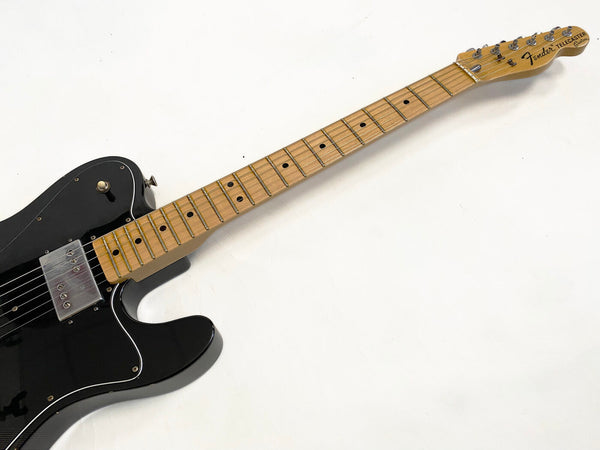 Black Fender Telecaster electric guitar with maple neck and fretboard on white background