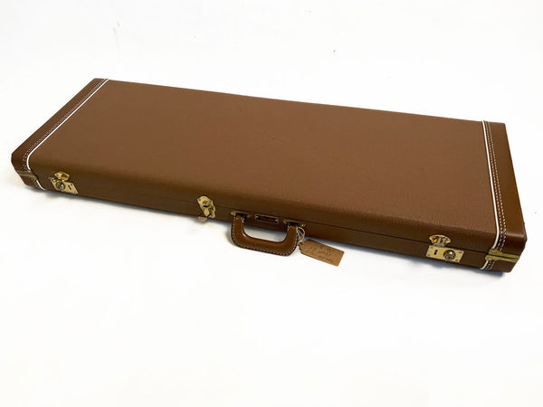 Brown vintage-style hard guitar case with white stitching and brass latches for electric guitar storage and transport