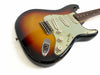 Vintage sunburst electric guitar with three single-coil pickups, volume and tone control knobs, and worn finish on body edges.
