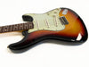 Vintage sunburst electric guitar with three single-coil pickups and rosewood fretboard on white background