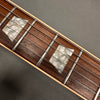 Close-up of guitar fretboard with pearl inlays and metal frets, Coffee House Guitars product detail image