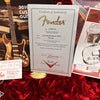 Fender Certificate of Authenticity for LTD 70th Broadcaster Relic guitar with serial number R102626, displayed on red velvet lining, alongside assembly and inspection tags and guitar information materials