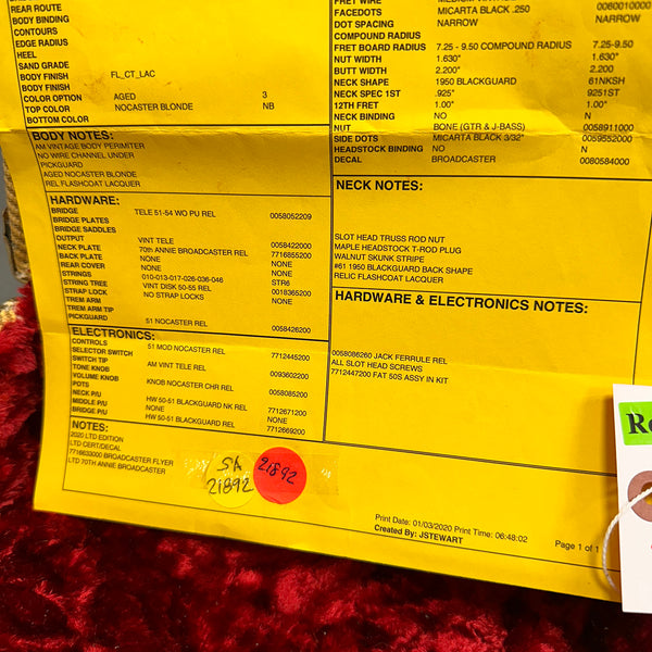 Close-up of a yellow specification sheet detailing hardware, electronics, body, neck notes, and finish for a 2020 LTD Edition 70th Annie Broadcaster guitar with aged nocaster blonde finish and relic flashcoat lacquer.