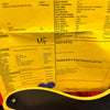Close-up of a yellow specification sheet for a Fender Telecaster guitar showing detailed hardware, electronics, neck, and pickup notes, partially covered by part of a yellow and black guitar body and a blue guitar pick.