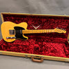 Vintage Fender Telecaster electric guitar with natural wood finish and black pickguard in open tweed hard case with red plush interior lining