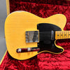 Vintage worn yellow Fender Telecaster electric guitar body with black pickguard and chrome hardware in red velvet case