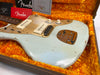 Fender vintage electric guitar with cream finish, white P90 pickups, and gold pickguard in orange plush-lined case with Fender documentation