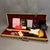 Fender Custom Shop electric guitar in sunburst finish with maple neck in tweed hard case with red plush interior and accompanying certificates and manuals