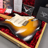 Vintage Fender Stratocaster sunburst electric guitar in tweed case with red plush interior and Fender Custom Shop certificates and manuals