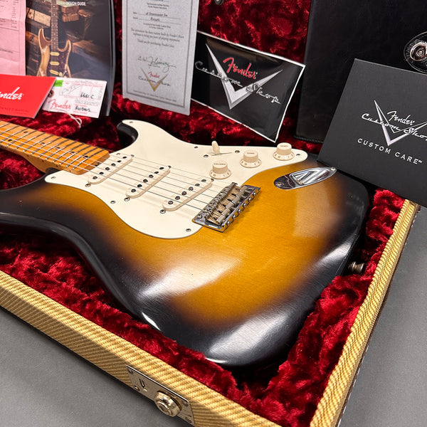 Vintage Fender Stratocaster sunburst electric guitar in tweed case with red plush interior and Fender Custom Shop certificates and manuals