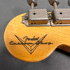 Close-up of Fender Custom Shop logo on light wood guitar headstock with vintage Kluson tuning machines