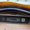 Electric guitar body showing sunburst finish on a DYMO digital scale displaying a weight of 3.324 pounds