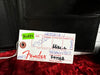 Fender guitar inspection tag with RoHS sticker, handwritten assembly, tune/test, and inspector details on red plush background