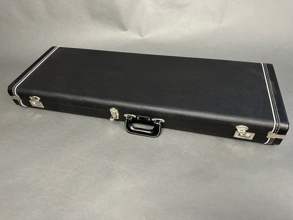 Black hard shell guitar case with silver latches and handle for electric guitars, protective storage and transport case by Coffee House Guitars.