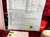 Close-up of certification and inspection paperwork for a Late 59 Telecaster guitar with detailed specifications on hardware, electronics, neck, and body notes, placed on a red plush guitar case lining with a certificate and Fender branded items partially visible in the background