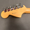 Back view of Fender electric guitar headstock with six chrome tuning pegs and serial number US17081191 on natural wood finish