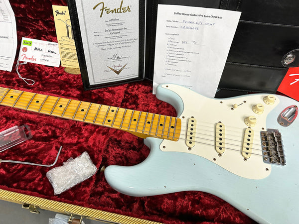 Fender Ltd 57 Stratocaster Jimi Hendrix signature electric guitar with maple neck and light blue body in red velvet-lined case with Fender authenticity certificate and Coffee House Guitars pre-sale checklist.