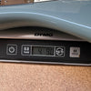 Close-up of digital scale showing weight of electric guitar at 4.90 pounds on DYMO scale for Coffee House Guitars product listing.