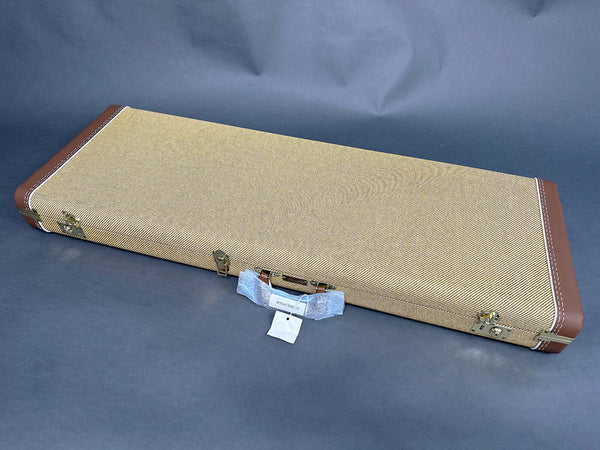 Rectangular tweed guitar case with brown leather corners and metal latches on a gray background, Coffee House Guitars product listing image.