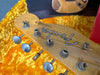 Close-up of Fender Telecaster guitar headstock with tuning pegs in vintage orange plush case