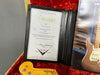 Fender Certificate of Authenticity for 55 Stratocaster Jim Relic guitar in black leather holder inside red velvet guitar case with Fender Stratocaster headstock and guitar catalog