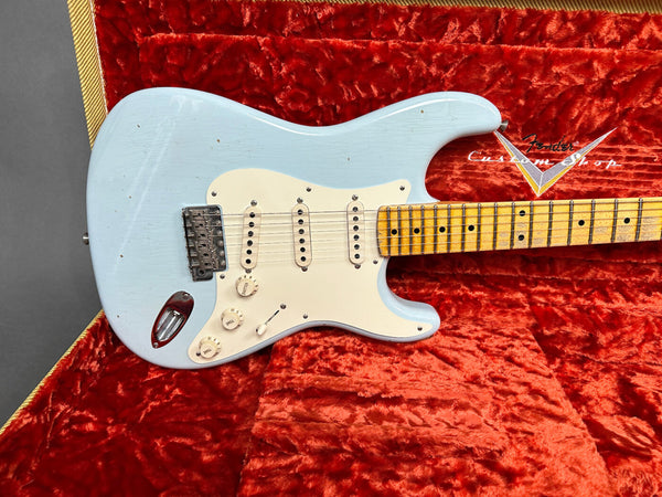 Light blue Fender Stratocaster electric guitar with maple neck and vintage white pickguard in red velvet-lined Fender Custom Shop guitar case