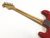 Back view of red electric guitar showing maple neck with skunk stripe and chrome tuning pegs on white background