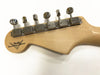 Close-up of Fender Custom Shop electric guitar headstock showing six chrome tuning pegs on light maple wood neck