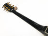 Back view of black guitar neck and headstock with gold tuning pegs on white background, Coffee House Guitars product image