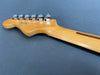 Close-up of maple guitar neck and headstock with six chrome tuning pegs on gray background from Coffee House Guitars product listing.