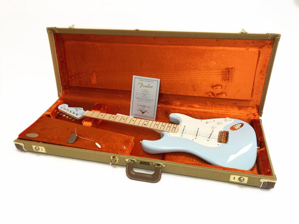 Fender electric guitar in light blue finish with maple neck and white pickguard inside vintage tweed hard case with orange plush interior and certificate of authenticity