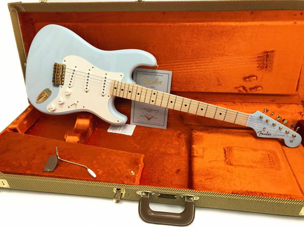 Fender Stratocaster electric guitar in light blue with maple neck and gold hardware inside vintage orange plush guitar case with Certificate of Authenticity and tremolo arm displayed