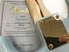Close-up of Fender 59 Stratocaster NOS guitar neck plate with serial number R87249 and accompanying Certificate of Authenticity from Fender Custom Shop in Corona, California dated 07/26/16.