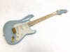 Fender Stratocaster electric guitar in light blue with maple neck and gold hardware on white background