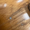 Close-up of wood grain and surface imperfections on a Coffee House Guitars acoustic guitar body