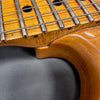 Close-up of guitar neck and body joint showing detailed wood grain and metal frets, highlighting craftsmanship of Coffee House Guitars electric guitar.