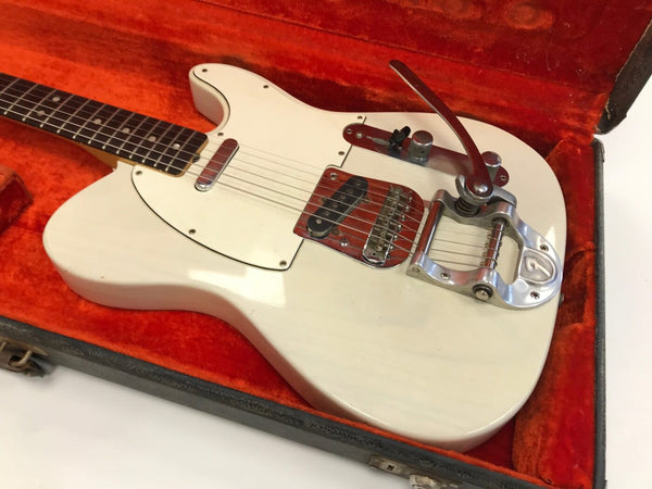 Vintage white Fender Telecaster electric guitar with Bigsby vibrato tailpiece in orange plush-lined hard case
