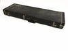 Vintage black rectangular guitar case with metal latches and handle, showing signs of wear and scuffs, isolated on white background