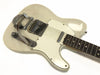 White vintage electric guitar with Bigsby vibrato tailpiece and single-coil pickups, rosewood fretboard, and white pickguard on white background