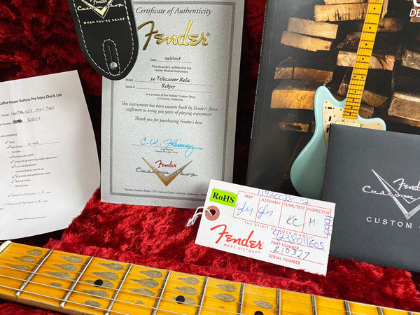 Fender Custom Shop Certificate of Authenticity for 54 Telecaster Relic guitar with serial number R18327, Fender Custom Shop Pre Sales Check List, Fender Custom Shop tag, and vintage maple neck fretboard on red plush guitar case lining.